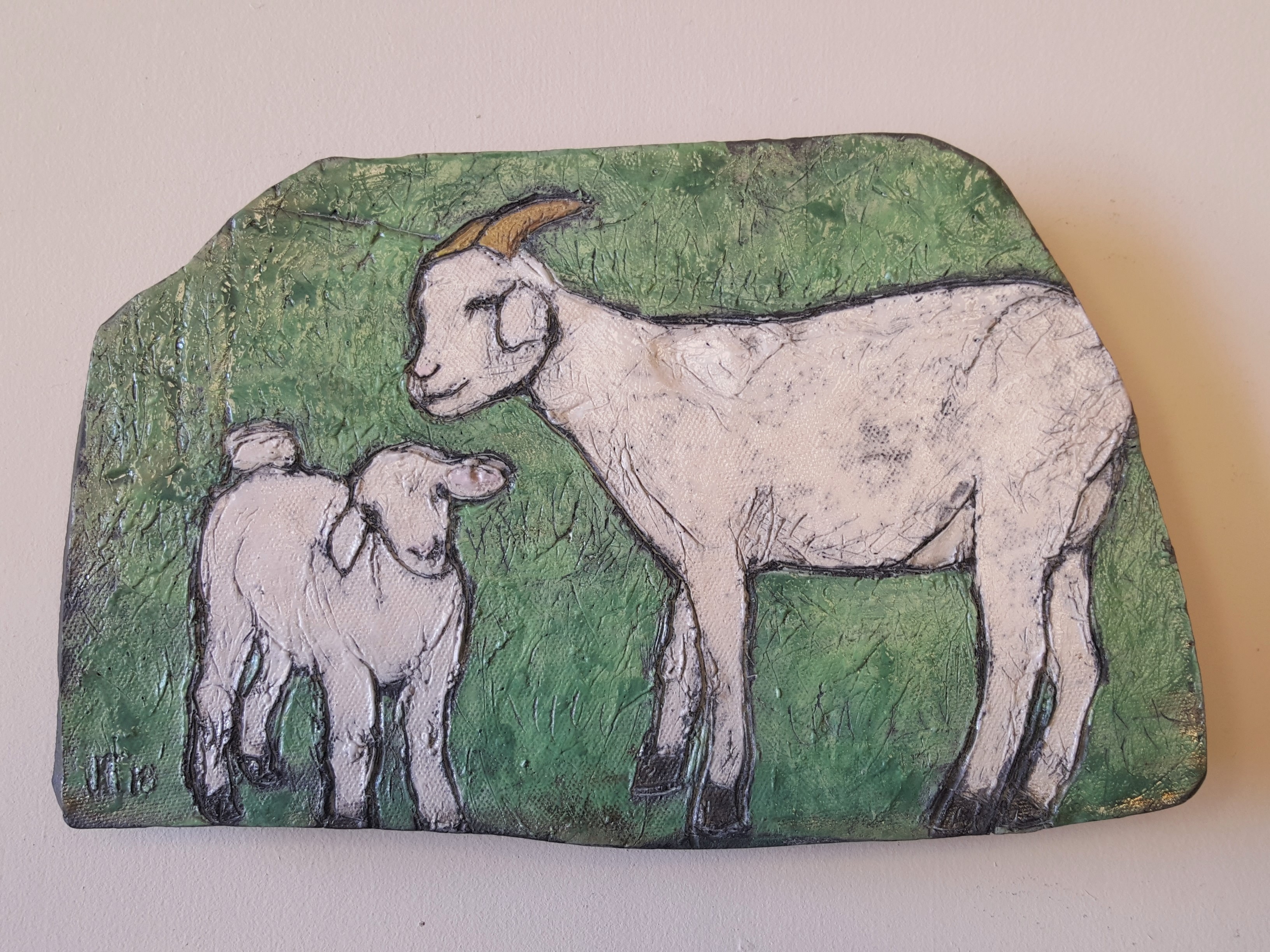 Mama and baby goat using process of Raku firing. Artist Julie Fakler